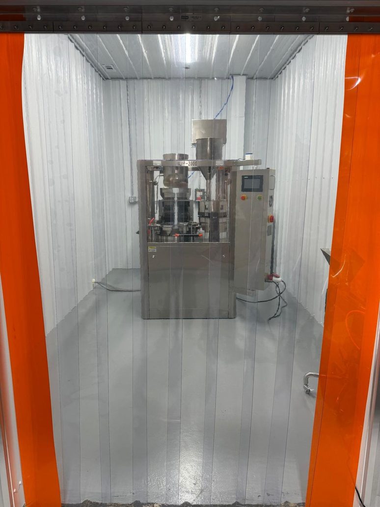 Looking into the production room through its strip curtain